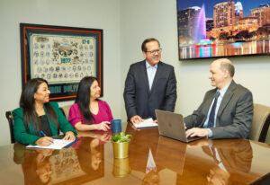 Attorneys at Payer Personal Injury Lawyers discussing about a case in our Orlando, FL law office