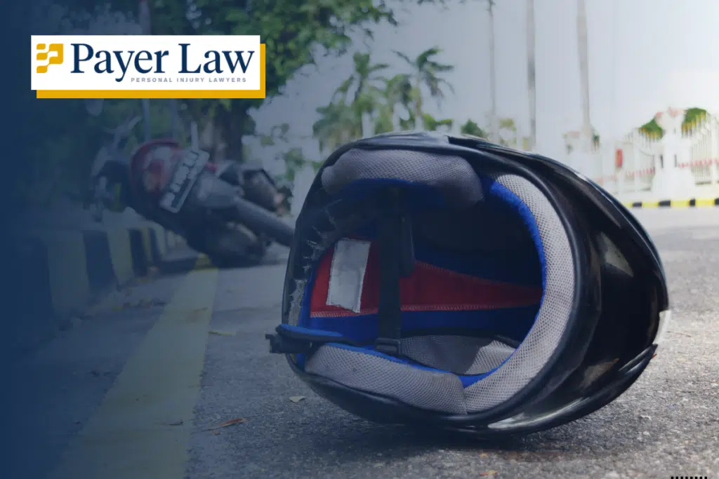 helmet on the road and a motorcycle in the background