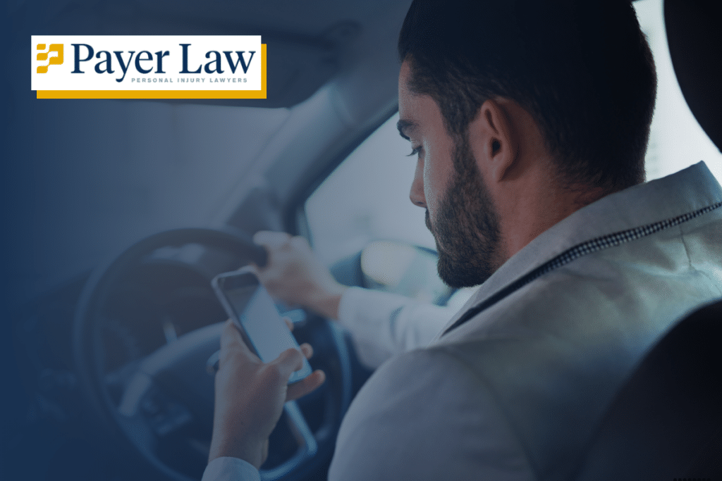 a man driving distracted while texting