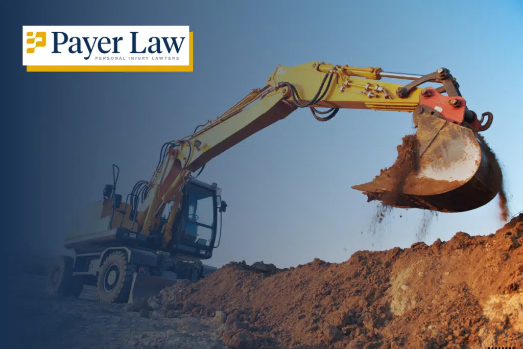 an excavator moving dirt on a construction site