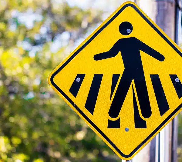 a sign for a pedestrian crosswalk in Miami-Dade