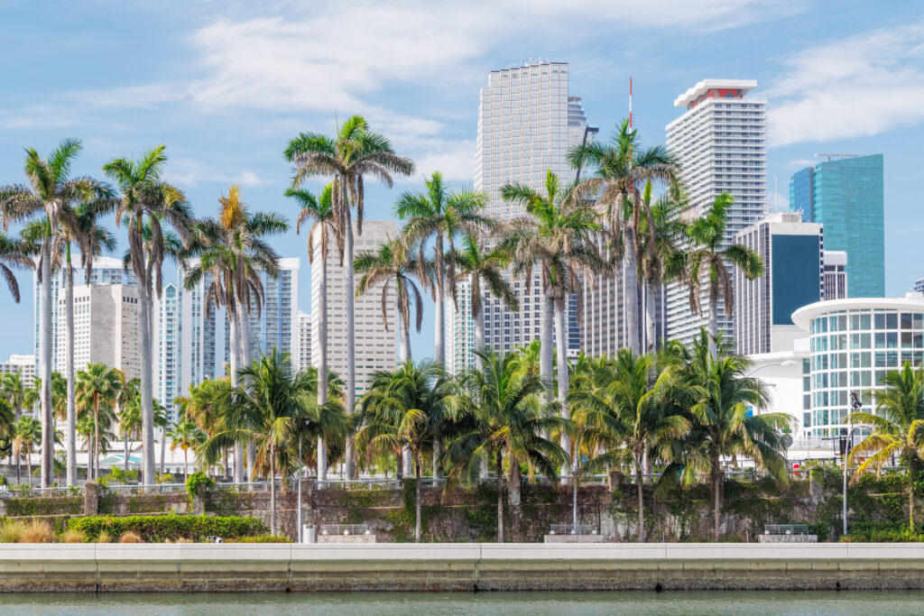 Modern skyline of Miami with towering skyscrapers, tropical vibe, and waterfront views